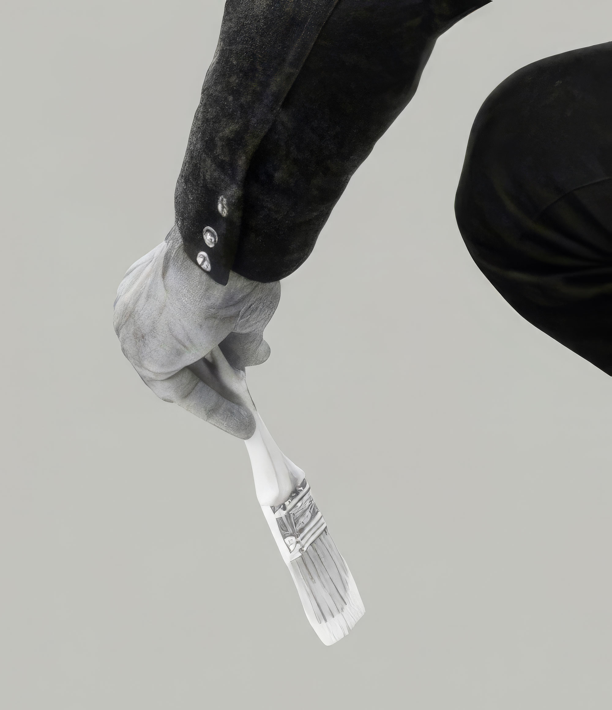 hand holding a paintbrush